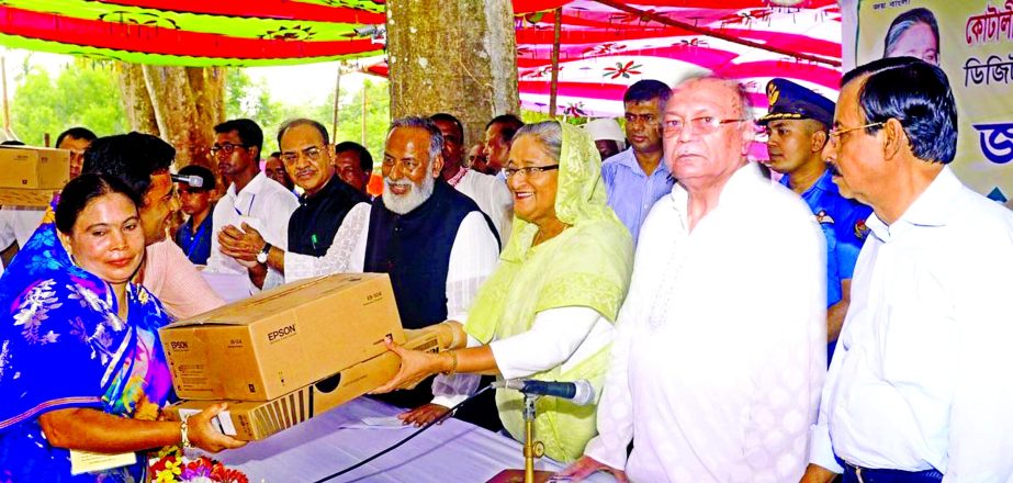 Prime Minister Sheikh Hasina hands over Laptops to 100 govt. primary and 14 high schools of Kotwalipara, Gopalgonj donated by Standard Bank Ltd recently. Kazi Akram Uddin Ahmed, Chairman of the Bank, Sheikh Fazlul Karim Selim MP, Colonel (Rtd.) Faruk Khan