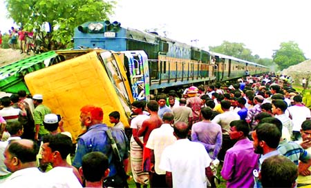 Two people were killed as Lalmonirhat bound train from Dhaka hit a truck at Gohailbari level crossing at Kalihati Upazila on Thursday.