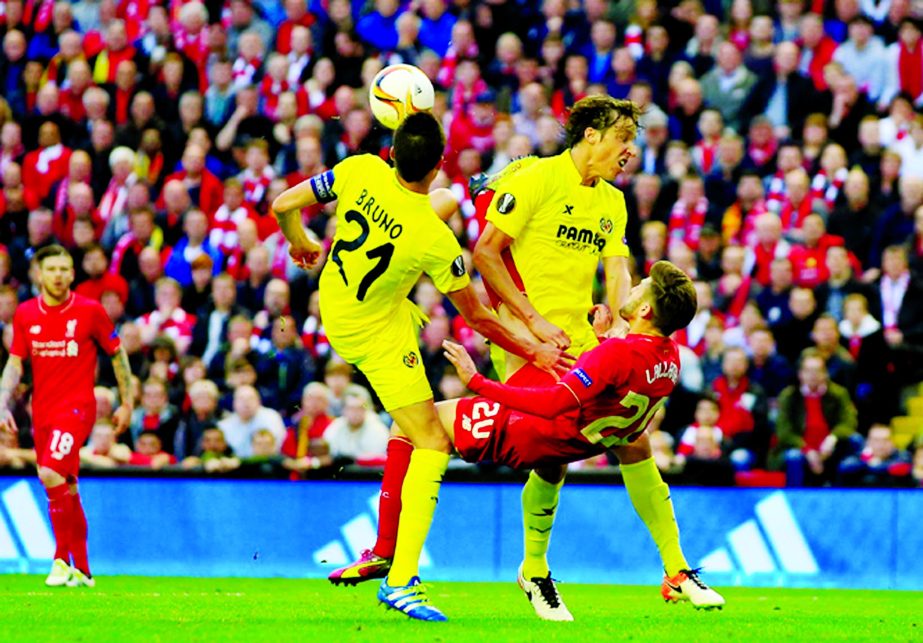 Liverpoolâ€™s Adam Lallana (centre) attempts an overhead shot at goal during the Europa League semifinal, second leg, soccer match between Liverpool and Villarreal at Anfield Stadium, Liverpool, England on Thursday.