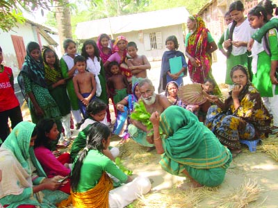 JHENAIDAH: Mamataz 'Kabiraj' treating an unknown snake bite affected girl at Defolbaria village in Jhenaidah.