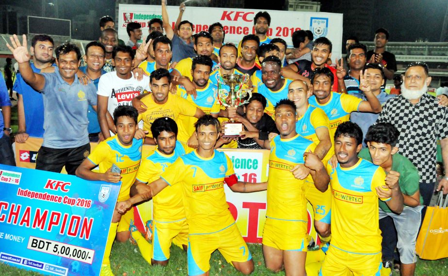 Members of Chittagong Abahani Limited celebrate with the trophy of the KFC Independence Cup Football beating Abahani Limited in the final at the Bangabandhu National Stadium.