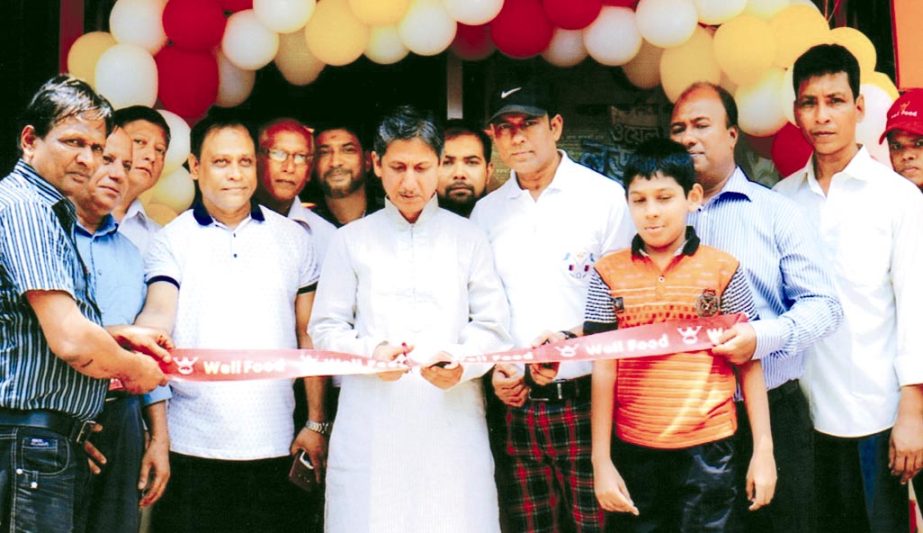 Chairman of Chittagong Development Authority Abdus Salam opening the showroom of Well Food at Dewan Bazar Sirajuddowla Road in the city yesterday.