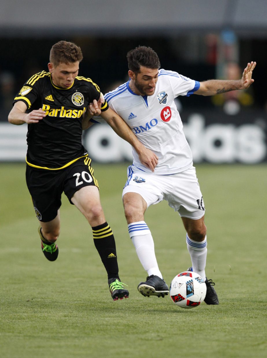 Montreal Impact midfielder Ignacio Piatti (right) of Argentina, works against Columbus Crew midfielder Wil Trapp during the first half of a MLS soccer match in Columbus, Ohio on Saturday.