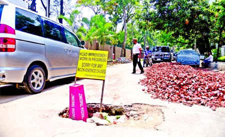 Besides a big uncovered manhole on the middle of the road at posh area in Gulshan, huge brick chips were being dumped causing an added misery to locals. This photo was taken from nearby British High Commission in city on Sunday.