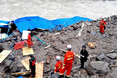 Rescuers use detectors to scan for potential survivors at the site following a landslide in Taining county in southeast China's Fujian province, on Monday.