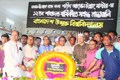 GAZIPUR: Prof Dr M A Mannan , Vice-Chancellor , Bangladesh Open University along with Pro-VC Prof Dr Khondoker Mokaddem Hossain, Treasurer Prof Dr Md Abu Taher and the teachers, officers and employees placing floral wreaths at the grave of Ahsanullah