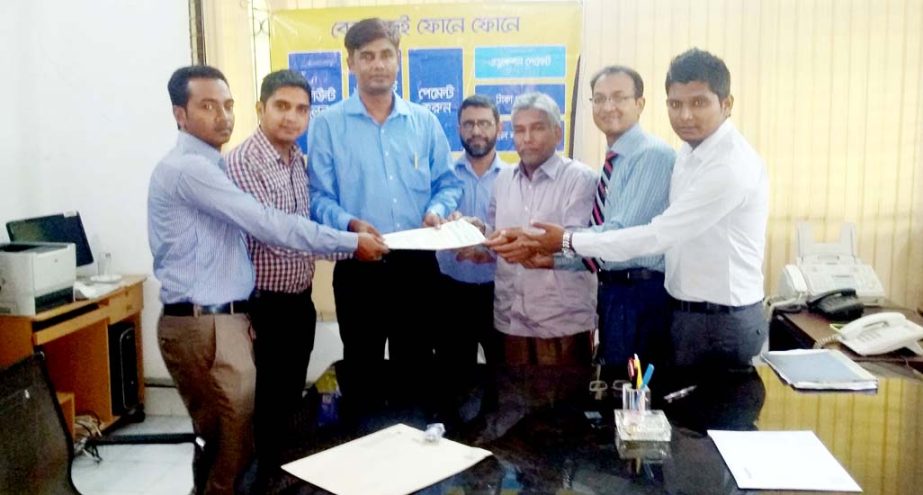 Vice President of Bangladesh Commerce Bank Ltd. SM Amir Hossain and Headmaster of Chittagong Collegiate School Giasuddin, Asst. Headmaster Mohammed Jahangir Alam Nizami sign an agreement to pay the school fee through BCB Sure Cash Mobile Banking recentl