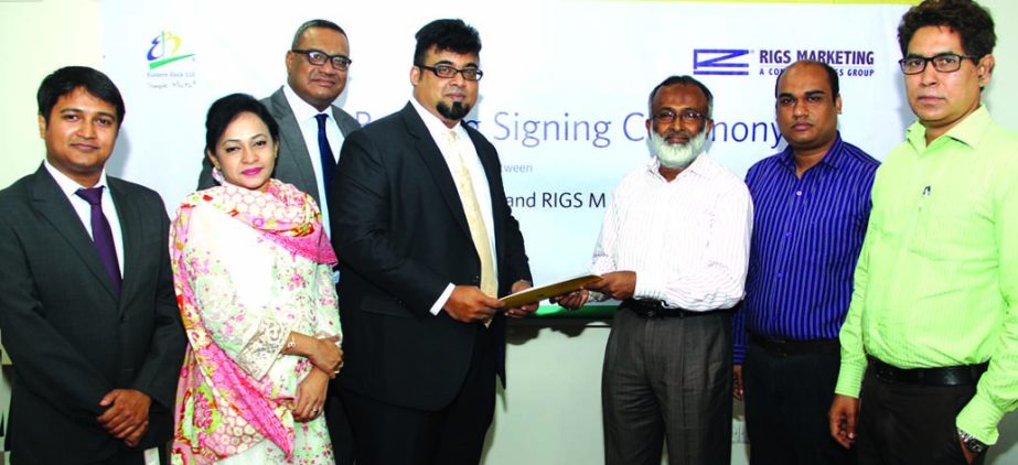 Nazeem A. Choudhury, Head of Consumer Banking of Eastern Bank Ltd (EBL) and Sk Humayun Kadir, Deputy Managing Director of Rigs Group exchange documents after signing a Payroll Banking Agreement in Dhaka recently.