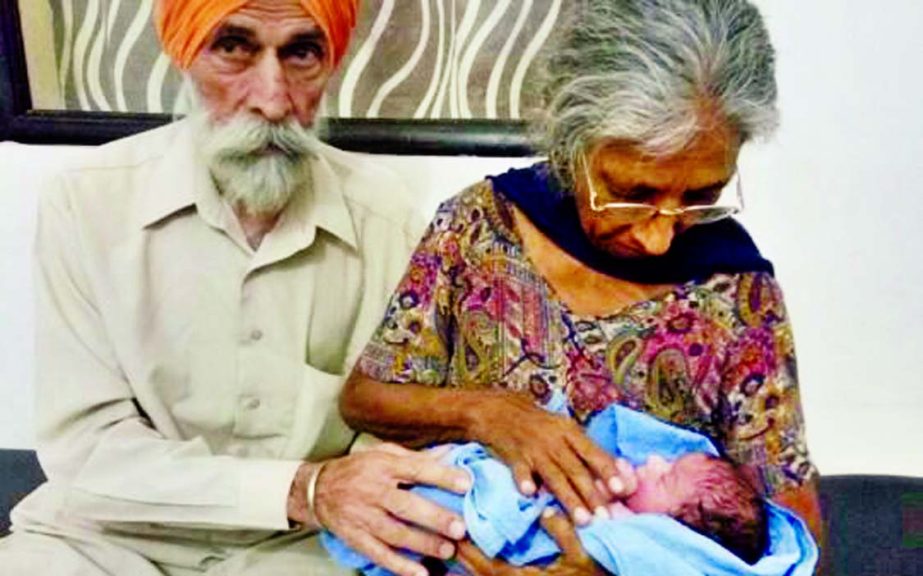 Mohinder Singh Gill and his wife Daljinder Kaur with their healthy baby boy, Arman Singh in Amritsar, India.