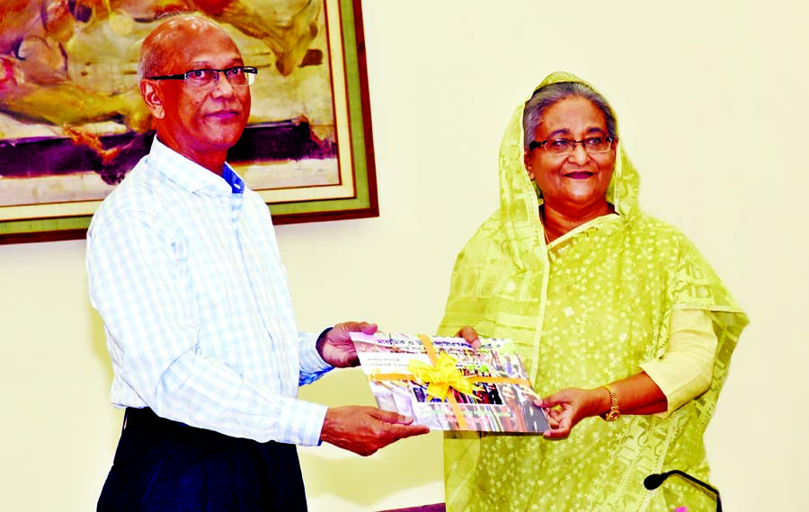 Education Minister Nurul Islam Nahid handing over result sheets of the SSC examination of all education boards to Prime Minister Sheikh Hasina at Ganobhaban on Wednesday.