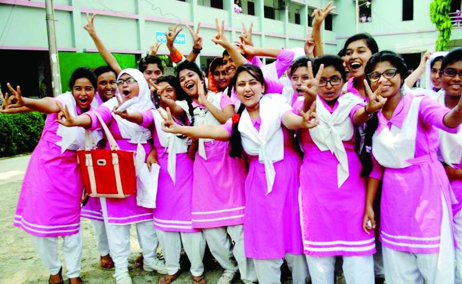 BARISAL: Jubilant SSC examinees of Barisal Government Girls High School showing V-sign after publishing of results yesterday.