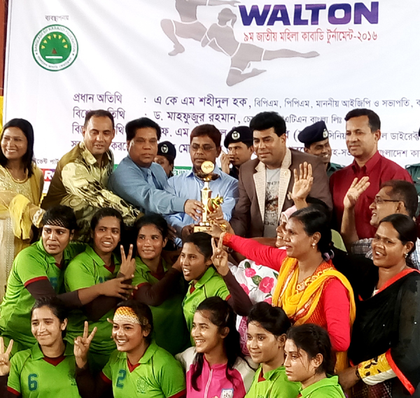 Members of BJMC, the champions of the Walton 9th National Women's Kabaddi Competition with the guests and the officials of Bangladesh Kabaddi Federation pose for a photo session at the Kabaddi Stadium on Wednesday.