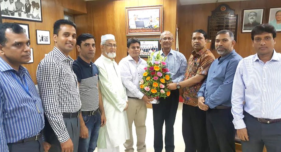 Members of the newly elected Executive Committee of Bangladesh Football Federation, General Secretary of Sylhet District Sports Association and President of Sylhet District Football Association Mahi Uddin Ahmed Selim greet Education Minister Nurul Islam N