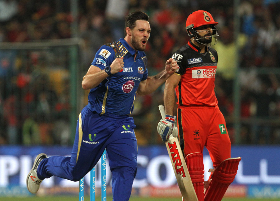 Mumbai Indians player Mitchell McClenaghan celebrates the wicket of Royal Challengers Bangalore captain Virat Kohli during match 41 of the Vivo IPL match at the M Chinnaswamy Stadium in Bangalore, India on Wednesday.