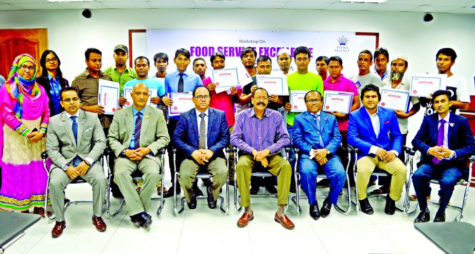 Shahid Hamid FIH, Chairman of PATA Bangladesh Chapter, RHTi principal Dr. Islam Md. Hashanat, Faisal Aziz, Director of Sales & Marketing and A.T.M Ahmed Hossain, Director of Food and Beverage of Dhaka Regency Hotel & Resort pose with the participants of a