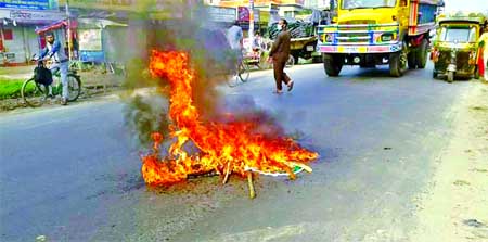 Jamaat-Shibir activists set fire on the street in city's Gazipur area on Thursday creating road blockade during hartal hours protesting execution of Matiur Rahman Nizami.
