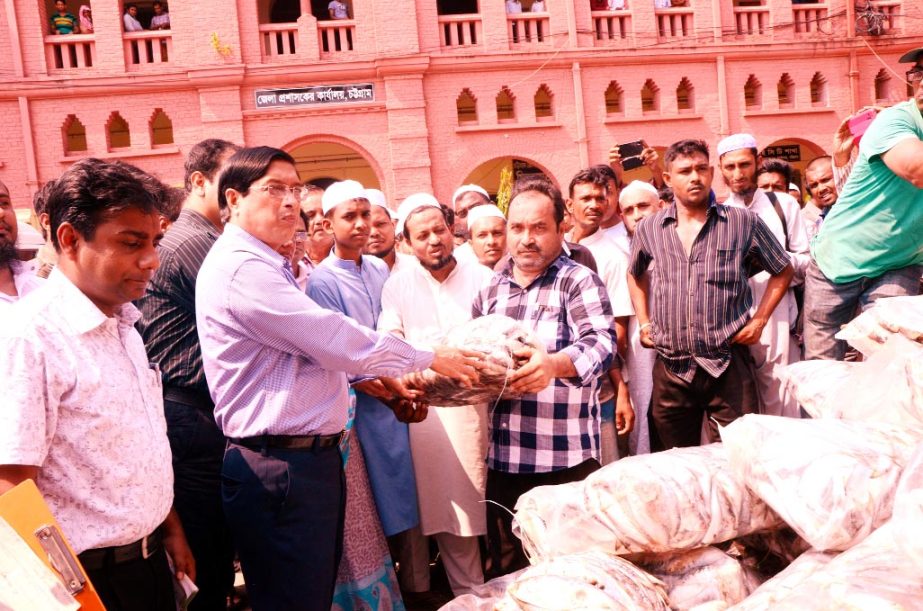 Deputy Commissioner of Chittagong Mezbauddin distributing Jatka to the Head of different orphanages that was recovered by the District Administration.
