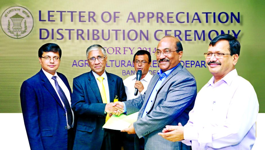 Ahmed Kamal Khan Chowdhury, Managing Director & CEO of Prime Bank is receives a Letter of Appreciation from Shitangshu Kumar Sur Chowdhury, Deputy Governor of Bangladesh Bank for achieving the disbursement target of Agricultural and Rural Credit for the