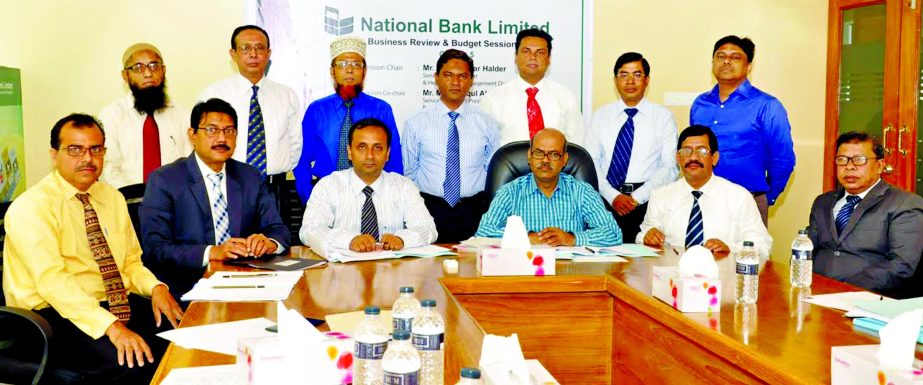 The high officials of National Bank Ltd poses at a Business Review & Budget Session-2016 for its managers' on Saturday.