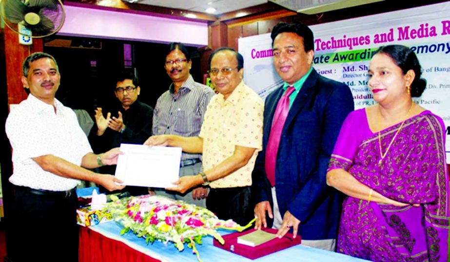 Director General of Bangladesh Press Institute Shah Alamgir handing over certificate to Deputy Manager (Public Relation) of Petrobangla Tariqul Islam Khan at the concluding ceremony of a training course on 'Communication Strategy and Mass Media' organiz