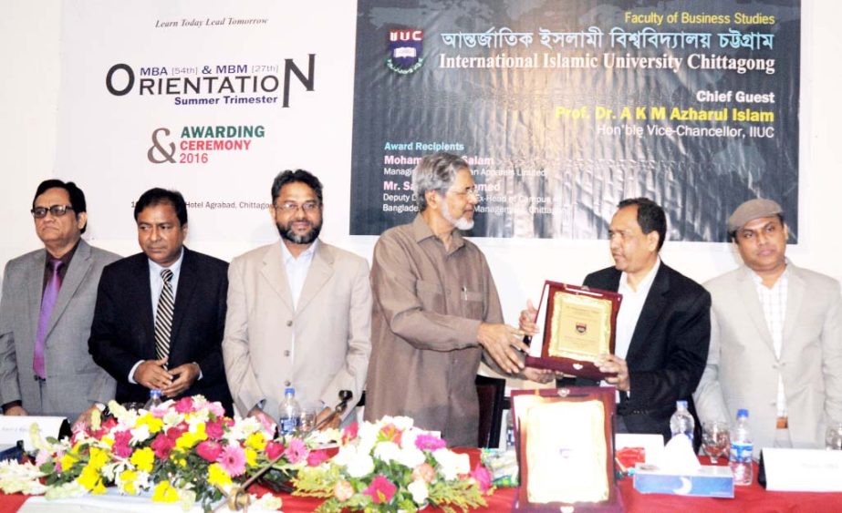 Prof Dr AKM Azharul Islam, VC, International Islamic University, Chittagong (IIUC) handing over IIUC Award -2016 to Managing Director of Asian Apparels and also the Chairman of Chittagong Club Ltd Md Abdus Salam for his outstanding performance in his