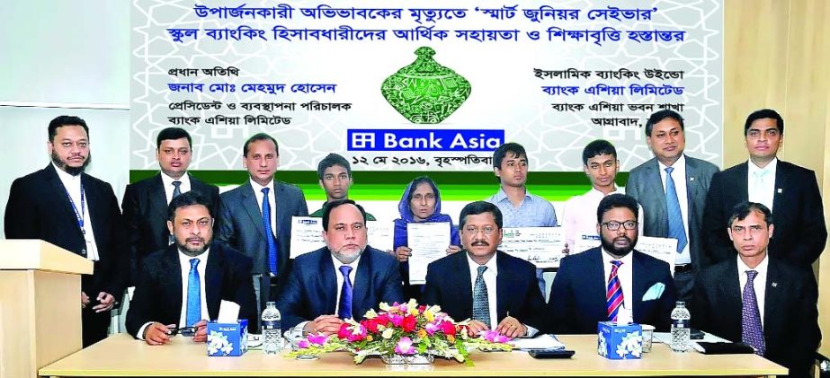 Md. Mehmood Husain, Managing Director of Bank Asia, handing over financial assistance & scholarship to three students of "Smart Junior Saver" school banking account holder due to guardian's death, in a simple ceremony at Bank Asia Bhaban, Chittagong r