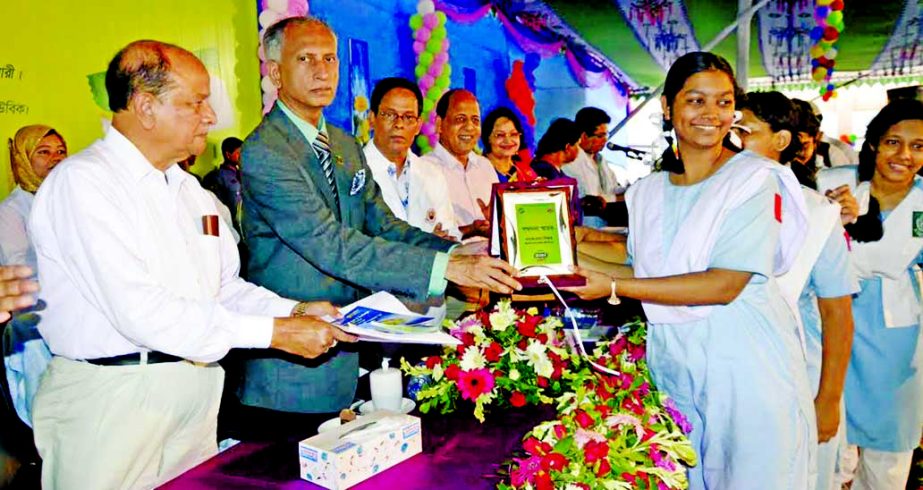 Vice-Chancellor of Dhaka University Prof Dr AAMS Arefin Siddique distributing prizes among the winners of a science fair organized recently at Monipur High School and College in the city.