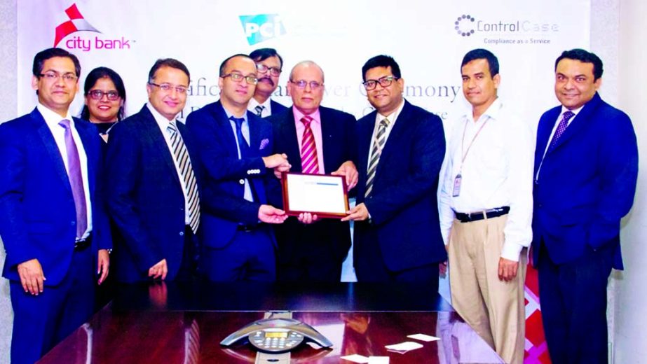 Mashrur Arefin, Additional Managing Director of City Bank Ltd, receiving documents of 'PCI DSS' certification from Suresh Dadlani, COO of ControlCase, a US-based security company at City Bank Head Office recently.