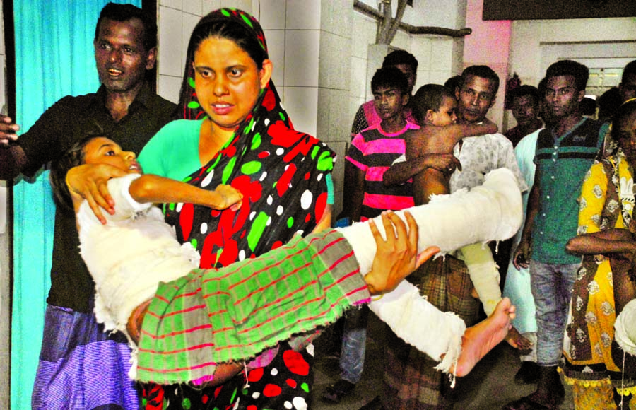 Panic-stricken relatives of patients at Dhaka Medical College Hospital's Burn Unit running helter-skelter with their patients for safer places due to sudden fire at the unit on Tuesday.