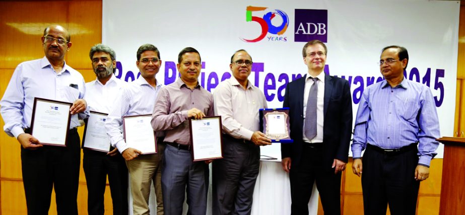 ADB has recently awarded three of its best performing project teams for the year 2015 in Bangladesh. Oleg Tonkonojenkov, Deputy Country Director of the ADB's Bangladesh Resident Mission along with award winning teams pose at a ceremony in Dhaka on Wednes