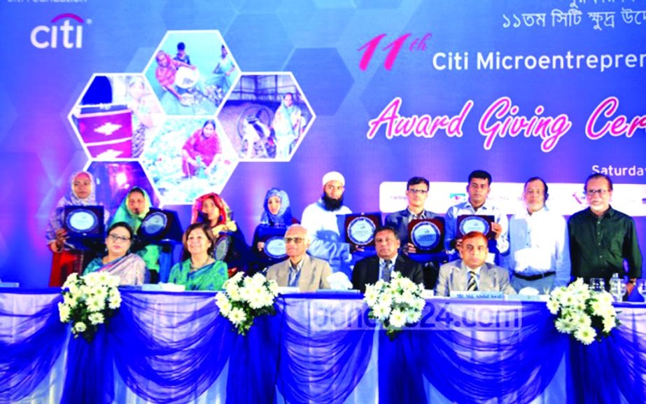 Former Advisor to the Caretaker Government, Rokeya Afzal Rahman and prominent economist, Wahiduddin Mahmud, among the winners of micro entrepreneurs and other guests pos after the award giving ceremony in the city on Saturday.