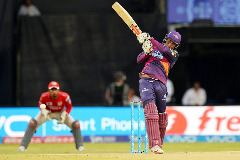 Rising Pune Supergiants batsman Usman Khwaja (R) plays a shot to the boundary during the 2016 Indian Premier League (IPL) Twenty20 cricket match between Rising Pune Supergiants and Kings XI Punjab at Dr. Y.S. Rajasekhara Reddy at the ACA-VDCA Cricket Stad