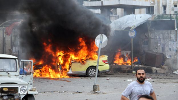 Near-simultaneous car and suicide bombings hit the main bus station in Tartous