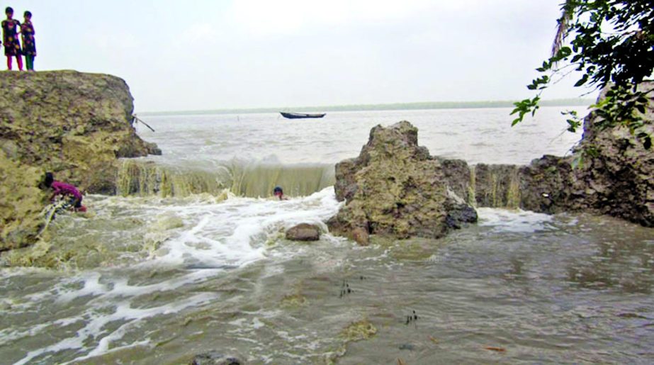 Embankment in Mohipur Union under Patuakhali district was damaged due to recent cyclonic storm Roanu. This photo was taken on Monday.