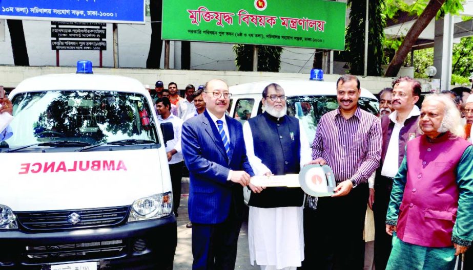 Liberation War Affairs Minister AKM Mozammel Haque along with other distinguished persons at the key handing over ceremony of ambulance for freedom fighters organized by National Freedom Fighters' Foundation in front of the Liberation War Ministry on Tue