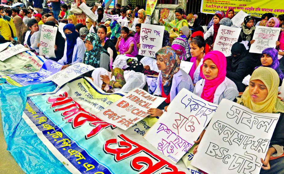 BMTPS members continuing their hunger strike in front of the Jatiya Press Club for implementing 10-point demands. This photo was taken on Tuesday.