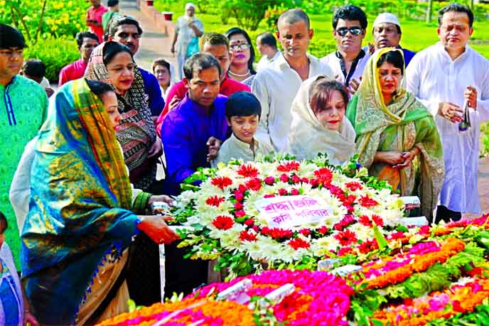 Marking the 117th birth anniversary of National Poet Kazi Nazrul Islam family members placing wreaths at his Mazar on Dhaka University campus on Wednesday.