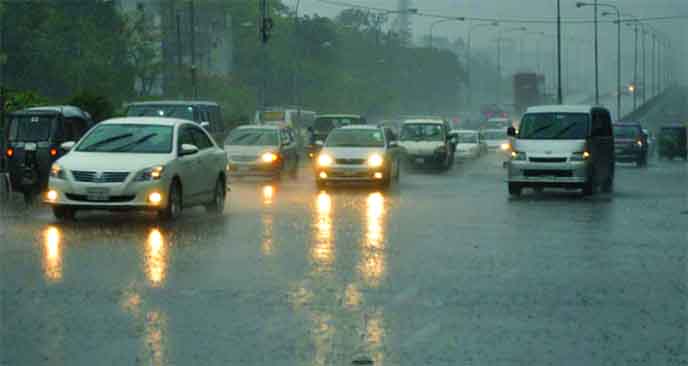 Vehicles with headlights on plying on streets as city experienced sudden stormy rain on Wednesday afternoon.