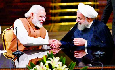 Iranian President Hassan Rouhani shaking hands with Indian Prime Minister Narendra Modi in Tehran.