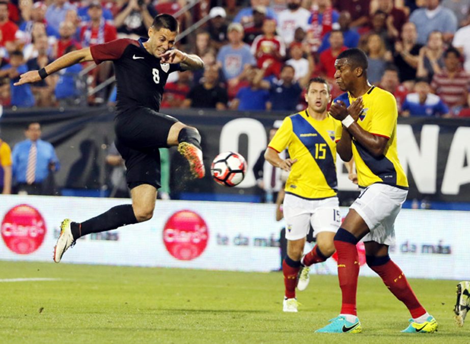 US forward Clint Dempsey (8) takes a shot as Ecuador's Pedro Larrea (15) and Frickson Erazo (right) defend in the second half of an exhibition soccer match in Frisco, Texas on Wednesday. The United States won 1-0.