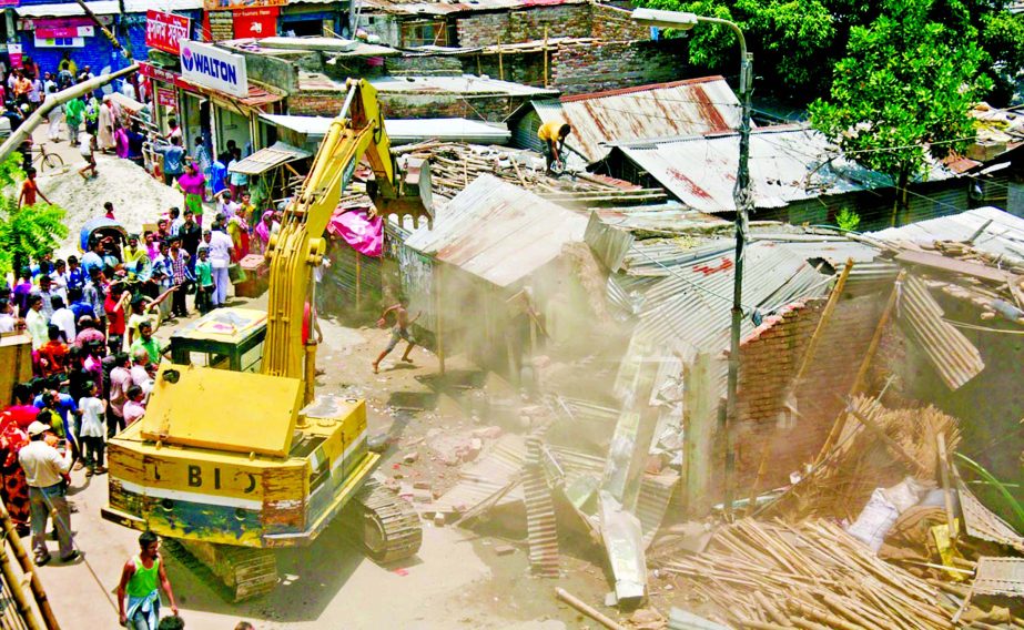 Housing and Settlement Authority dismantling unauthorised structures at Paris Road in Mirpur Section-11 on Thursday as continuous efforts to make city clean.