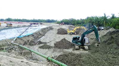 PATUAKHALI: Earth-filling works of Payera Biddut Kendro is going on in full swing . This picture was taken from Patuakhali yesterday.