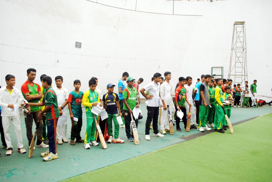 The participants of the ' Grass Root Level Talent Hunt Programme' and the instructors pose for a photograph at the BKSP in Savar on Saturday.