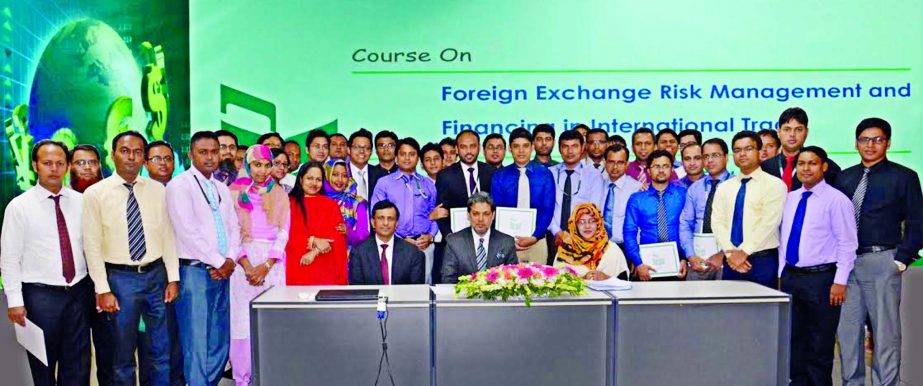 Choudhury Moshtaq Ahmed, Additional Managing Director of National Bank Limited poses with the participants of a 9 days long course on "Foreign Exchange Risk Management and Financing in International Trade" (36th Batch) at its Training Institute recently