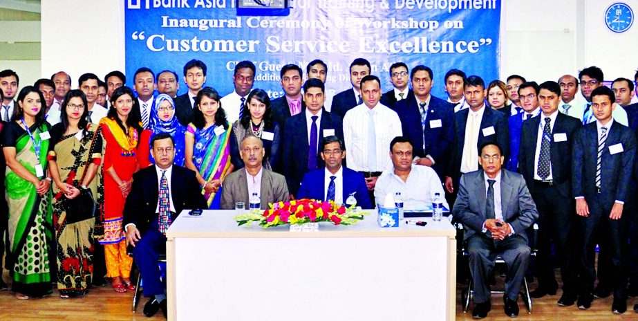 Md. Arfan Ali, Additional Managing Director of Bank Asia, poses with the participants of a day-long training on Customer Service Excellence at Bank's Training Institute in Dhaka on Saturday. Mian Quamrul Hasan Chowdhury, Deputy Managing Director, K.S. Na