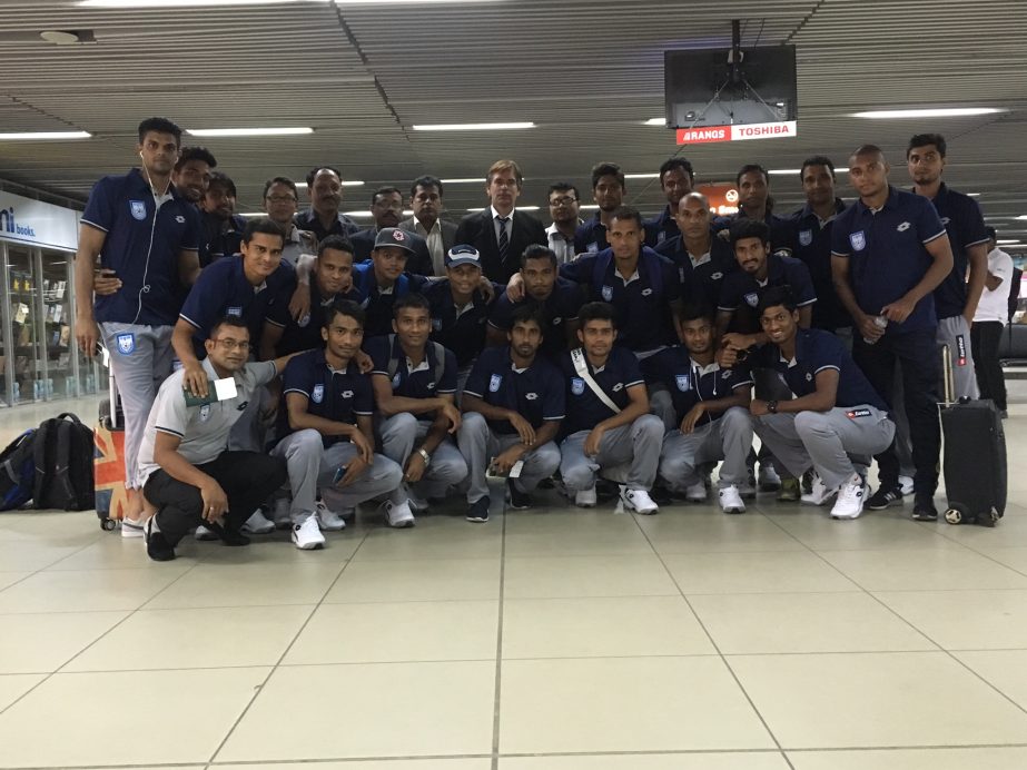 Members of Bangladesh National Football team pose for a photo session at the Hazrat Shahjalal International Airport on Sunday before leaving the city for Tajikistan to play in the AFC Asia Cup (away match) against Tajikistan.