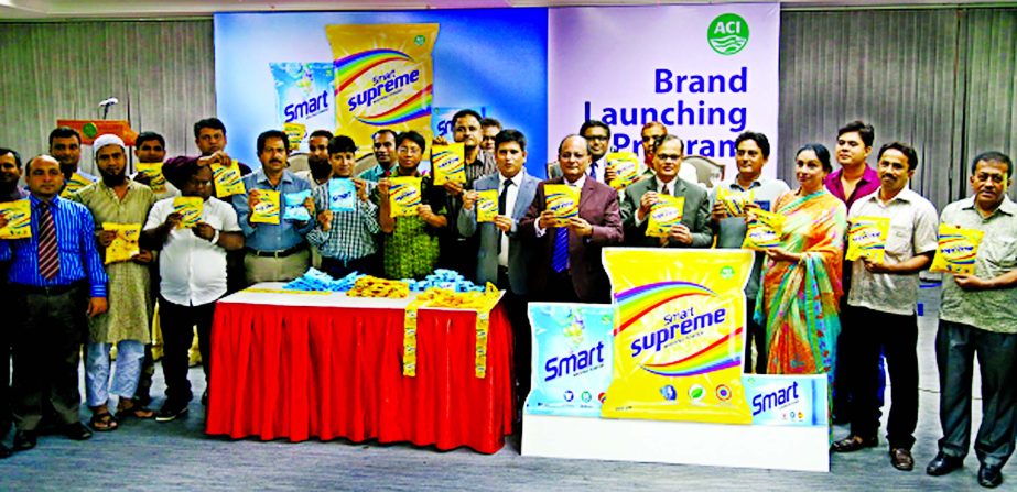 ACI's Executive Director Syed Alamgir, Business Director Md. Quamrul Hassan and ACI Consumer Brands' General Manager, Sales Md. Zakir Hossain Sarkar pose with the company's new product-'Smart Supreme Washing Powder' at ACI Center recently.