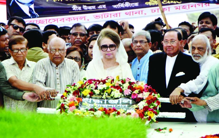 BNP Chairperson Begum Khaleda Zia along with party colleagues placing wreaths at the Mazar of Shaheed President Ziaur Rahman in the city on Monday marking his 35th death anniversary.