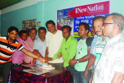 GOURIPUR( Mymensingh): Journalists of Gouripur Reporters' Club along with other guests cutting cake on the occasion of the 37th founding anniversary of The New Nation, the oldest national English on Sunday.