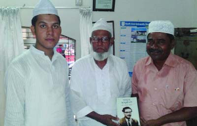 SYLHET: Md Abdur Rahim, General Secretary, Bangabandhu Char Neta Smriti Parishad donating book Incomplete Biography of Bangabandhu to the executives of Hazrat Shah Jalal(Ra) Darga on Sunday.